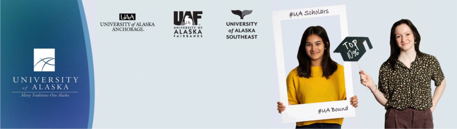 Two students holding UA Scholars signs