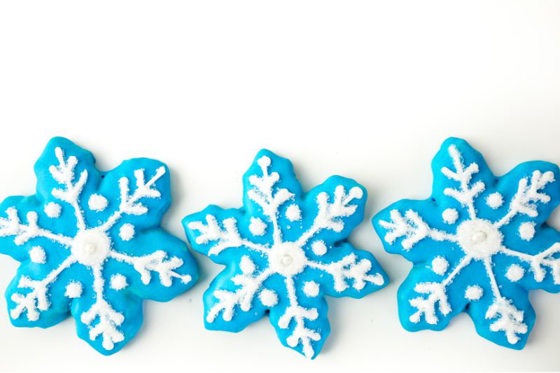 winter themed snowflake cookie with blue frosting