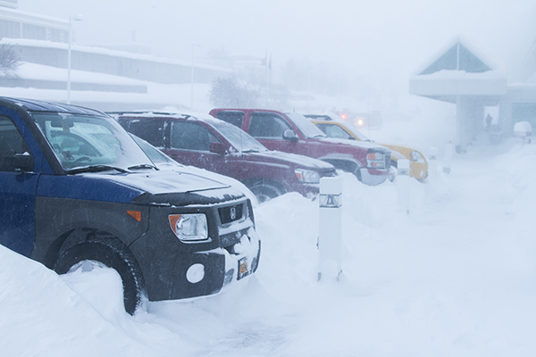 Cars parked in deep snow 