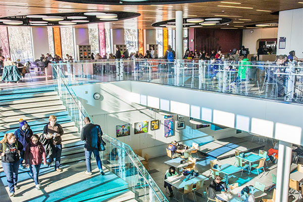 People walking on the steps in the Wood Center