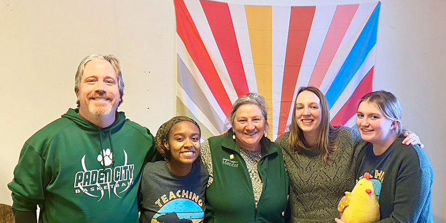 ASMP mentor group photo with four teachers in a school