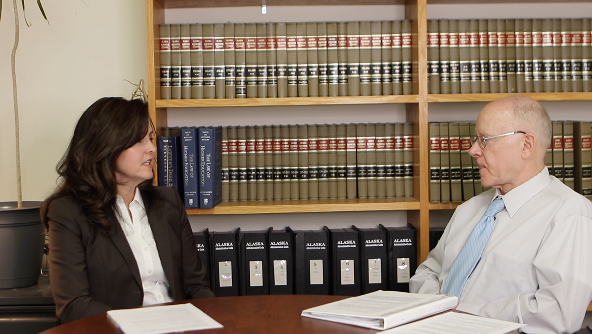 Mary and Andy talking at table