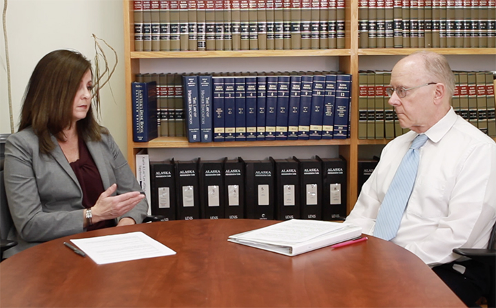 Mary and Andy talking at table
