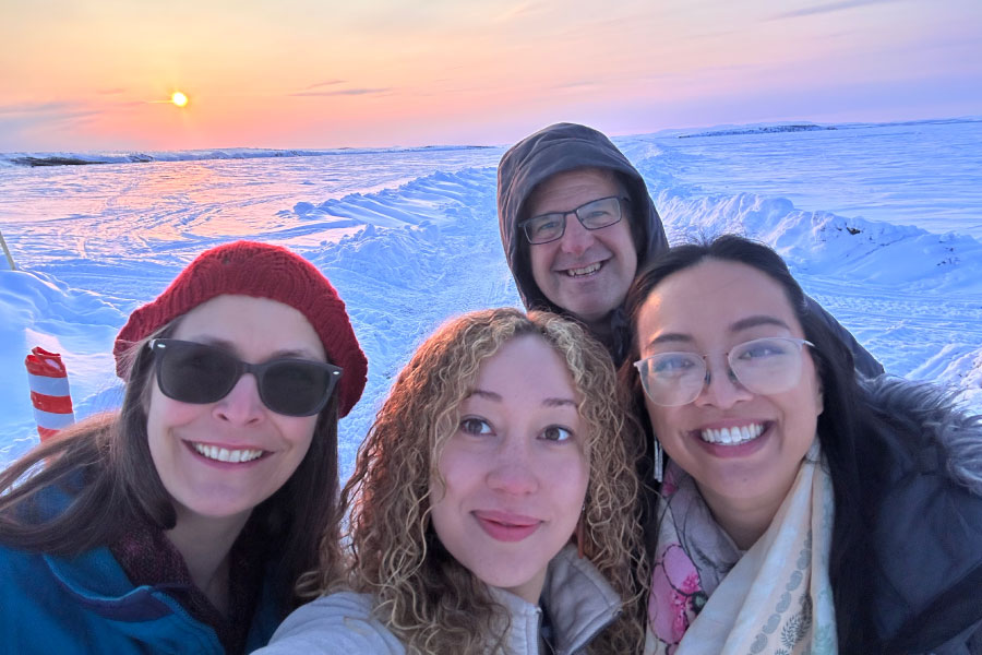 Smiling people outside in the cold winter