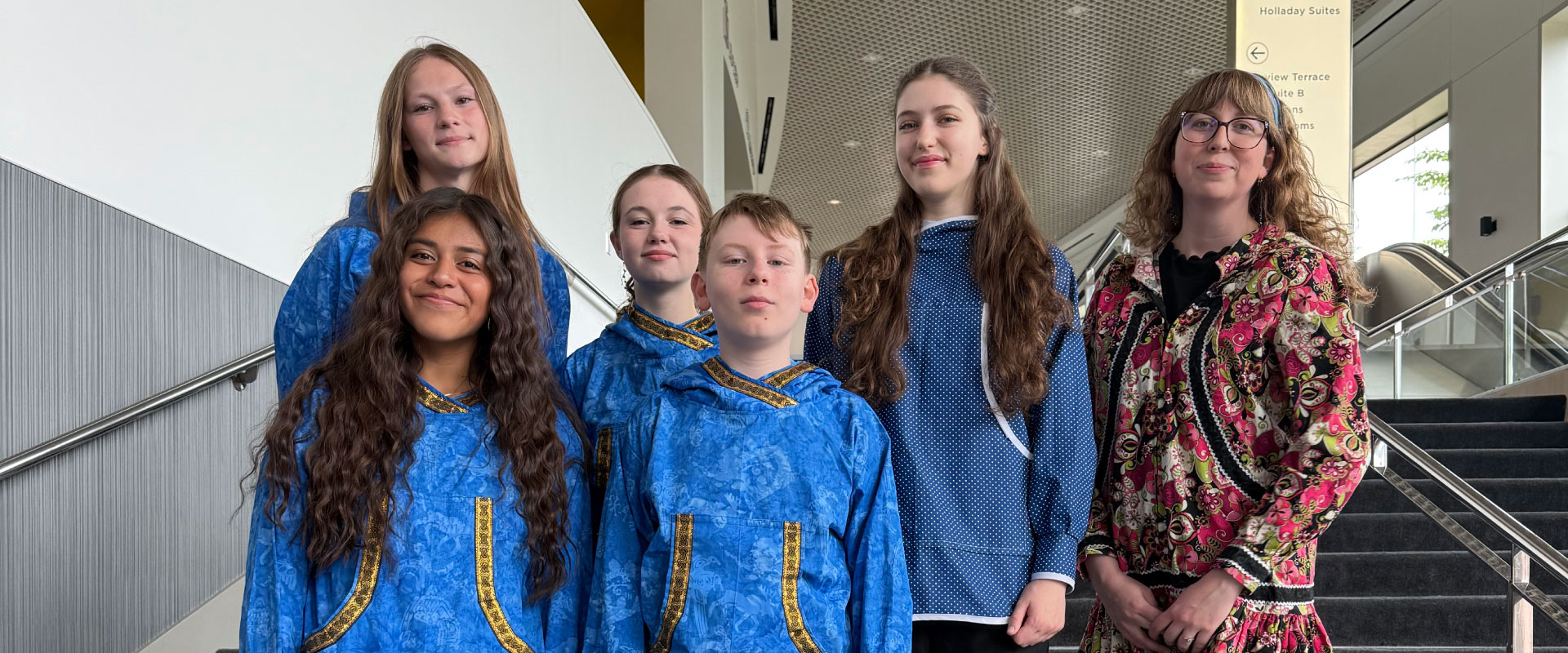 Group of students and instructor smiling at a the camera