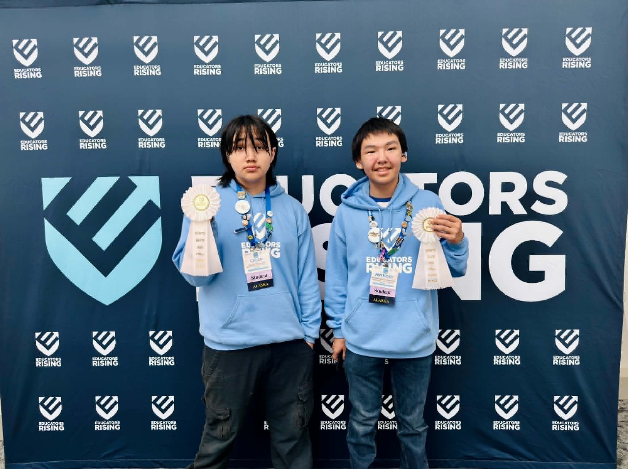 Two students with ribon awards