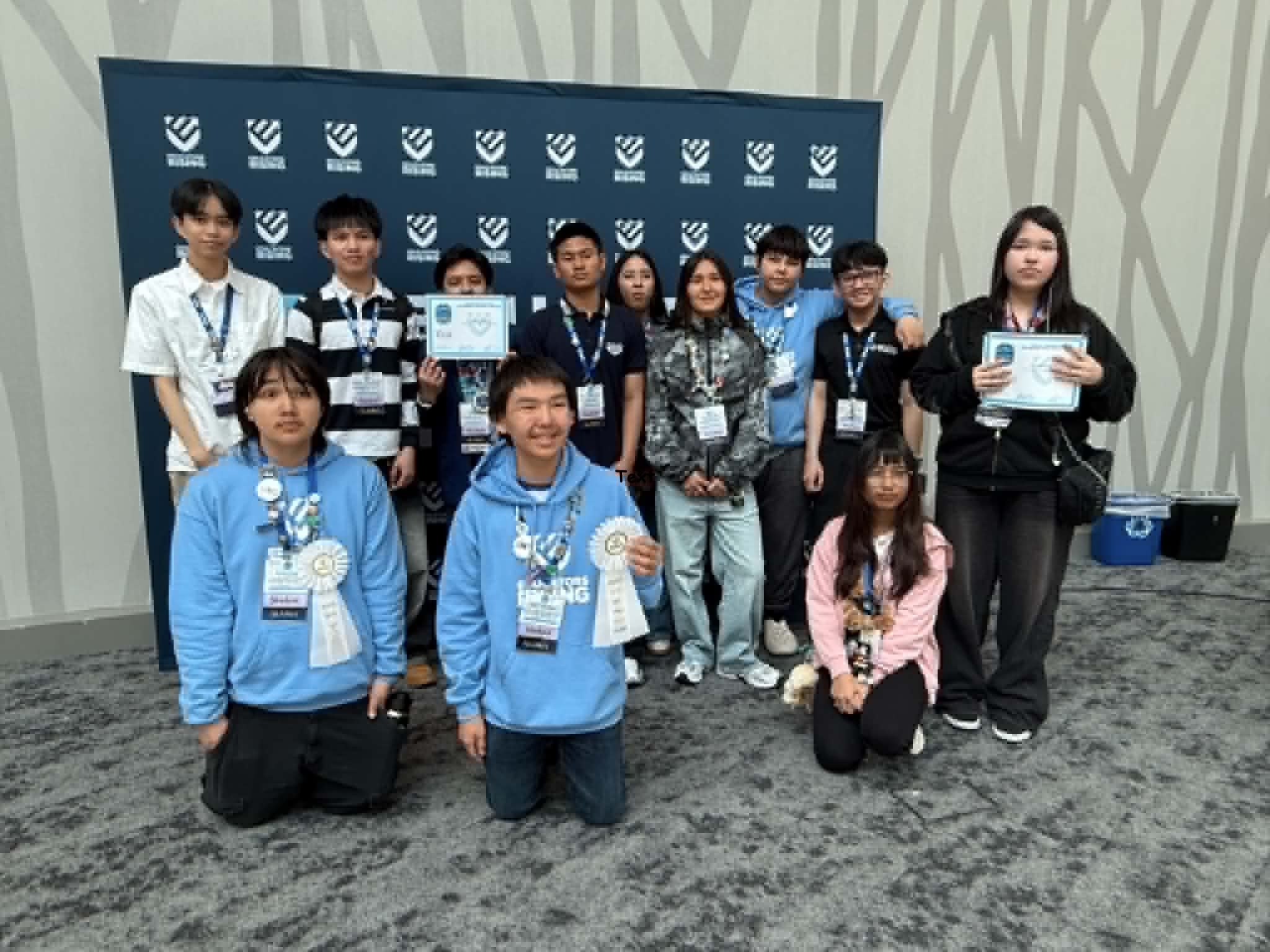 Group photo of students with awards