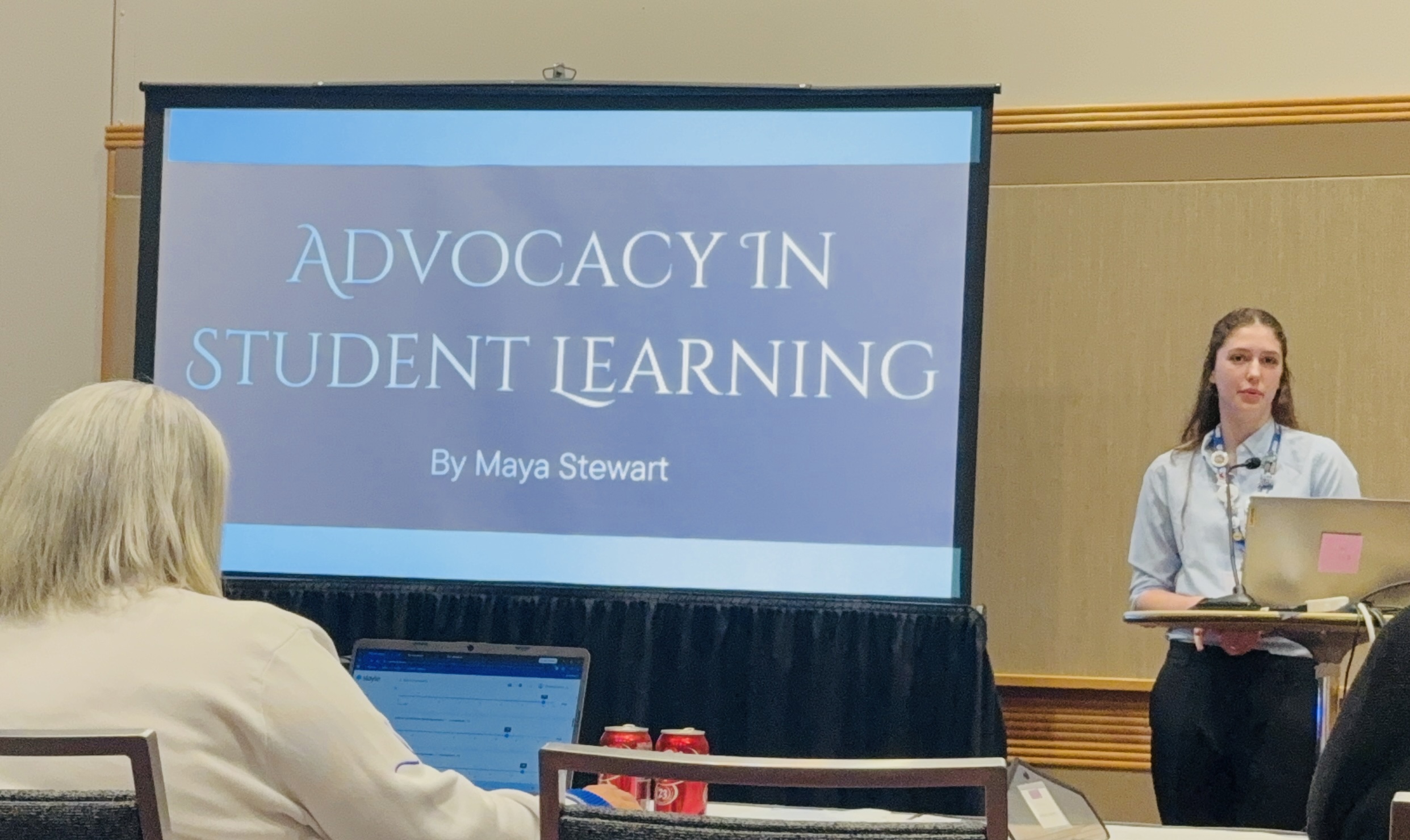 Student giving a slide show presentation