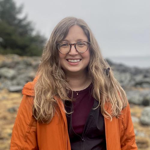 Lindsay Meyer on a rocky shore