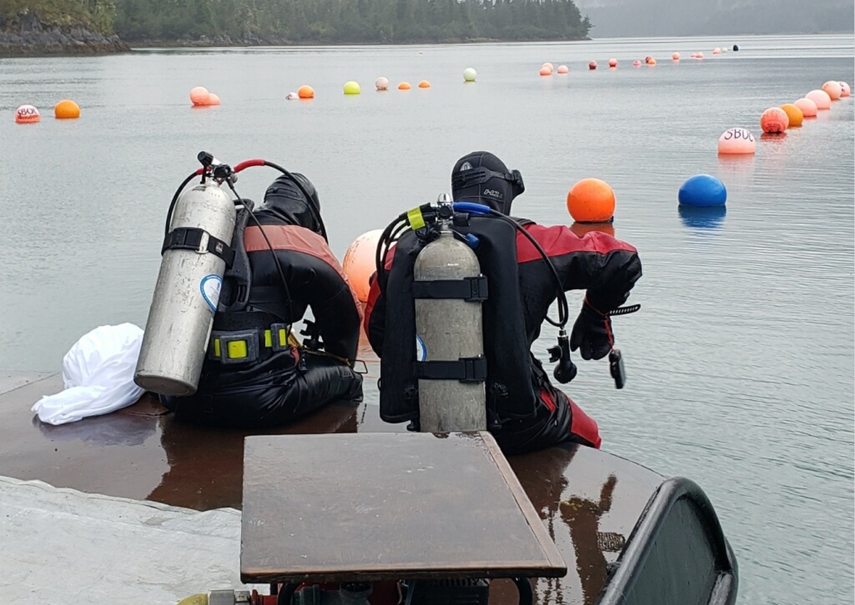 Photo by Sydney Wilkinson.
Interface of Change project director Brenda Konar, left, and University of Alaska Fairbanks postdoctoral researcher Brian Ulaski, right, prepare to survey an oyster mariculture farm in Simpson Bay near Cordova. 