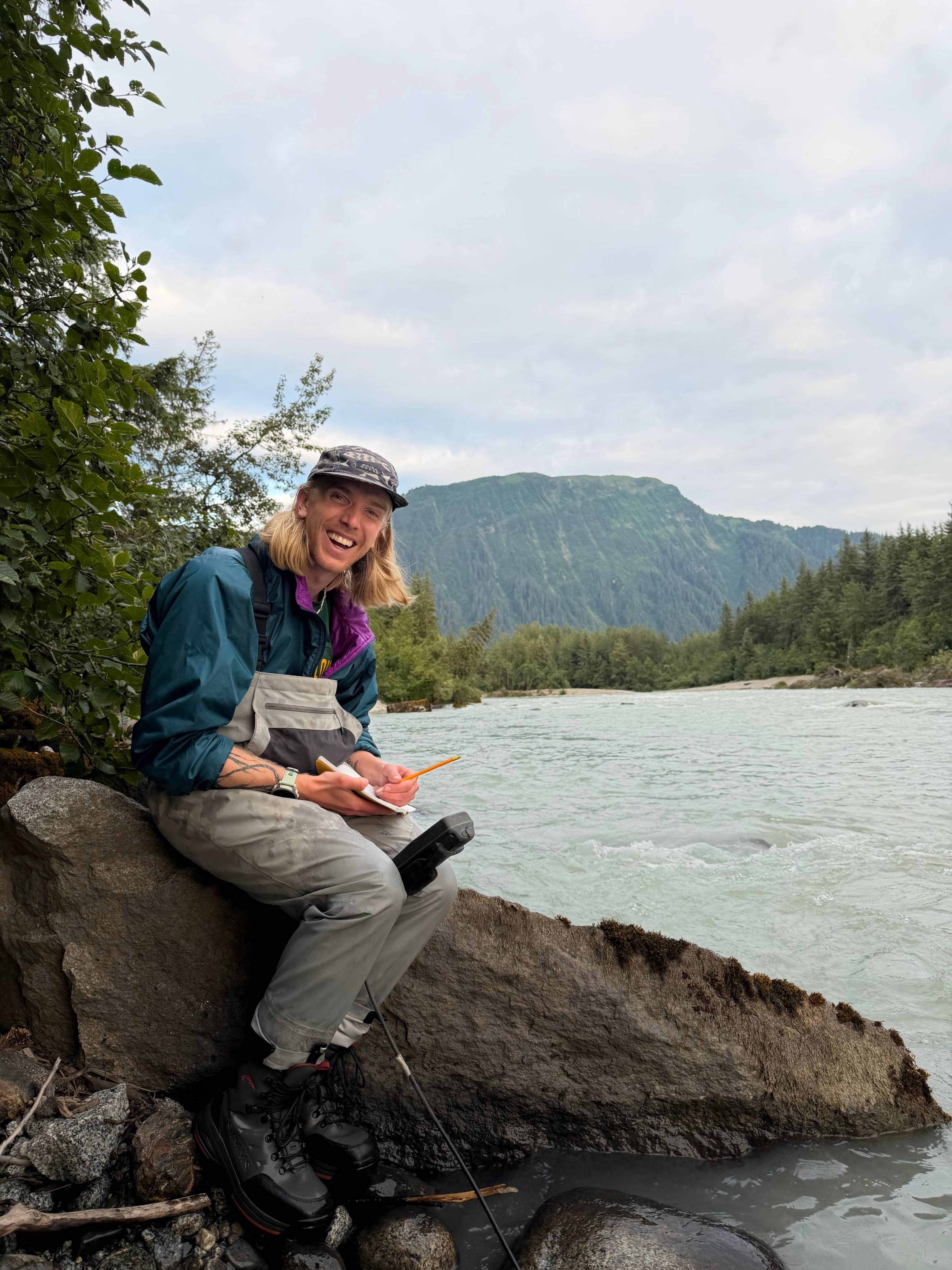 Wyatt Matyas taking flood measurements