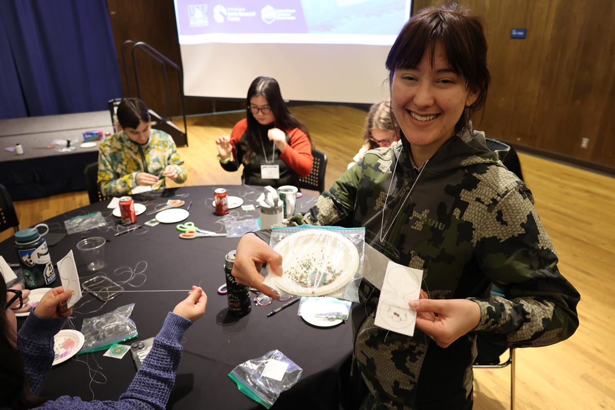 Students learning traditional Athabascan beading.