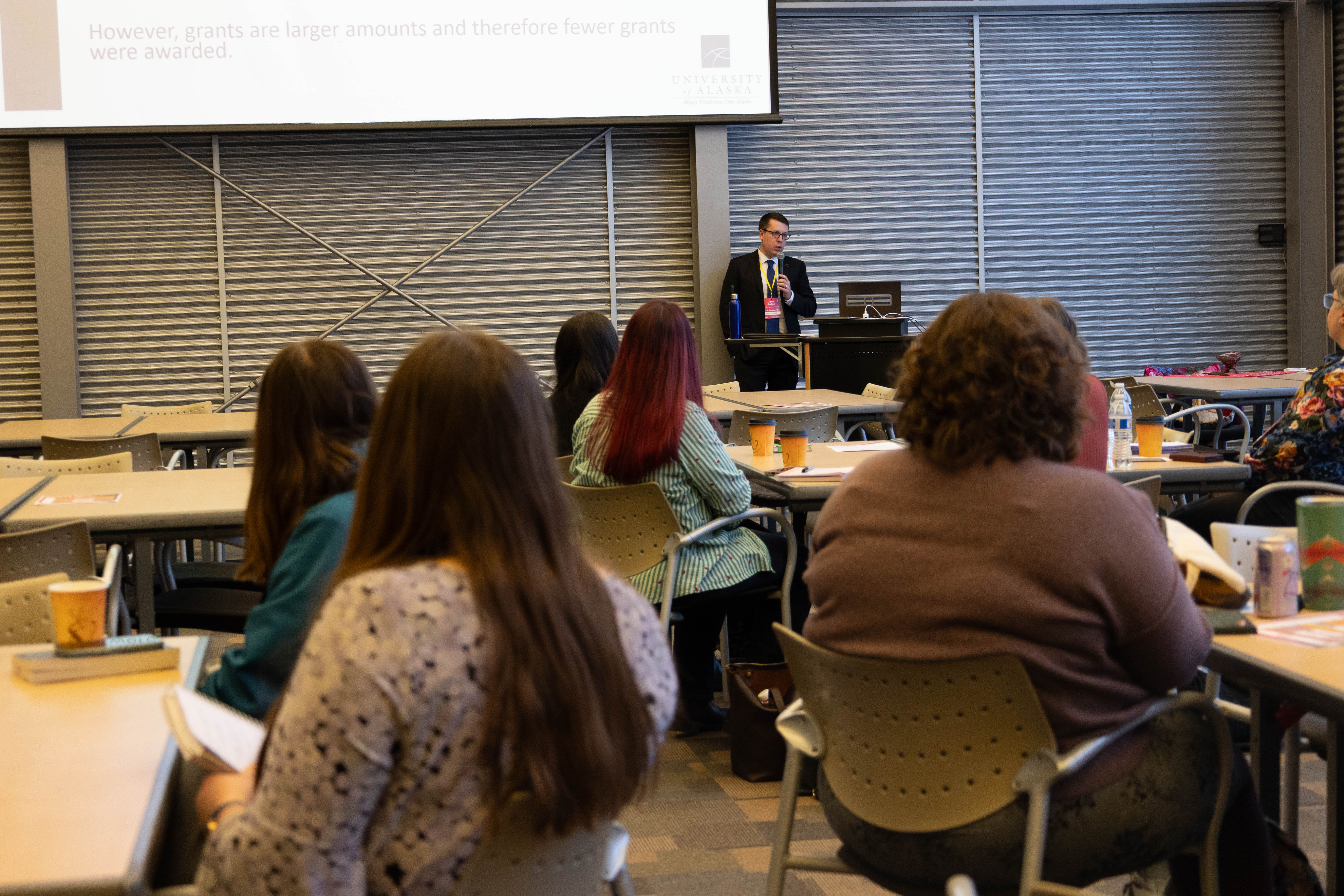 John Latini presenting.