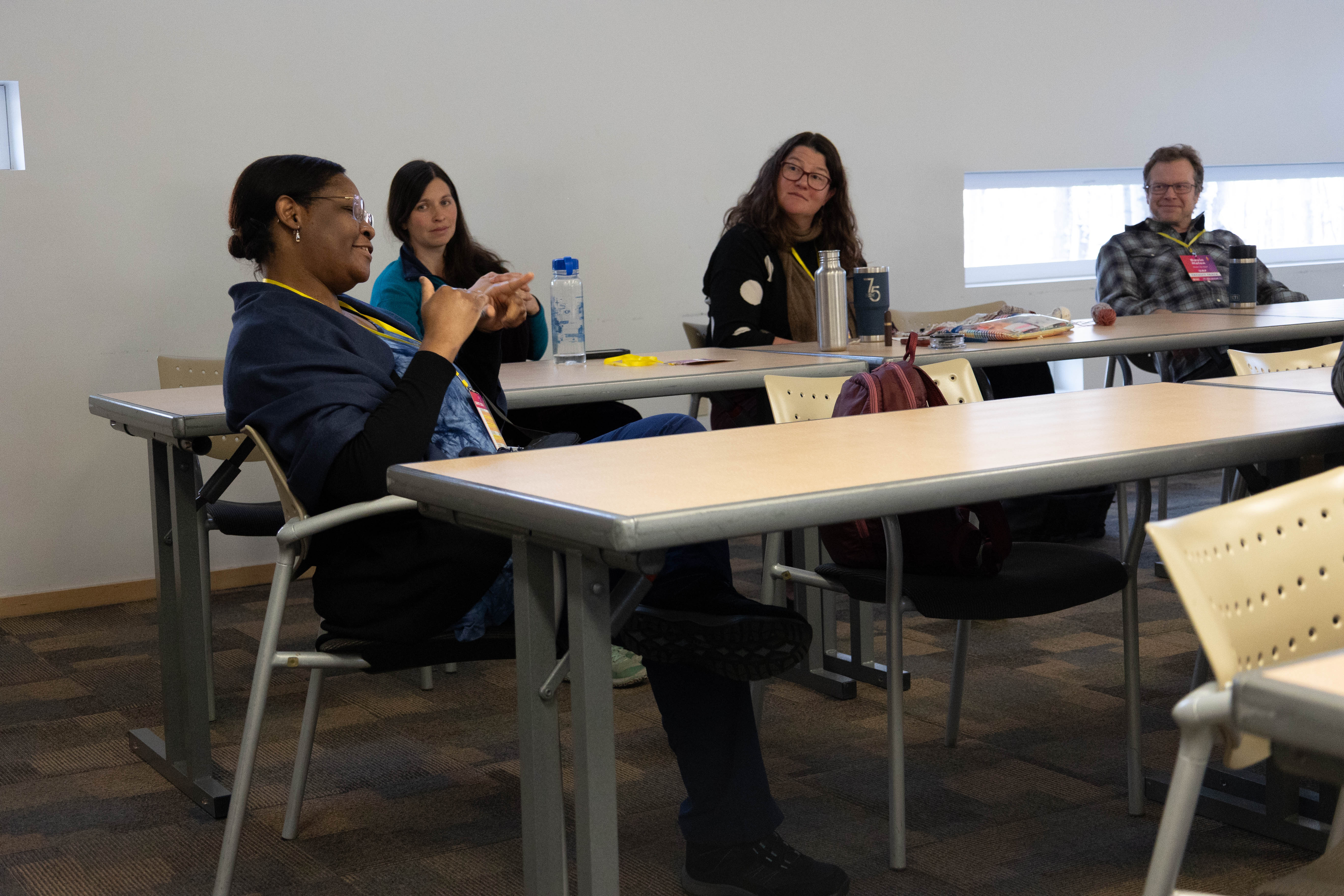 Faculty participating in a session.