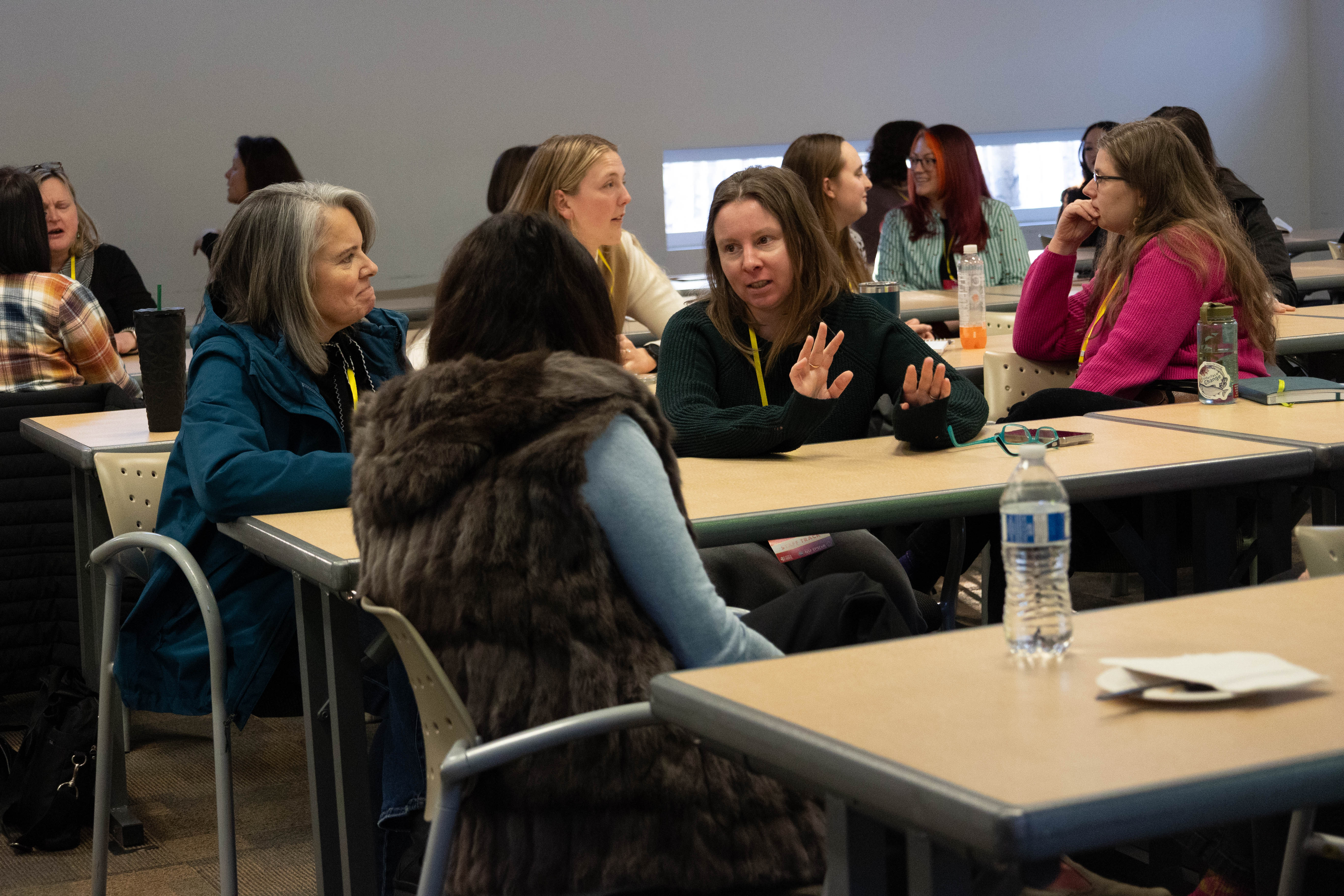 Staff having a discussion in a session.
