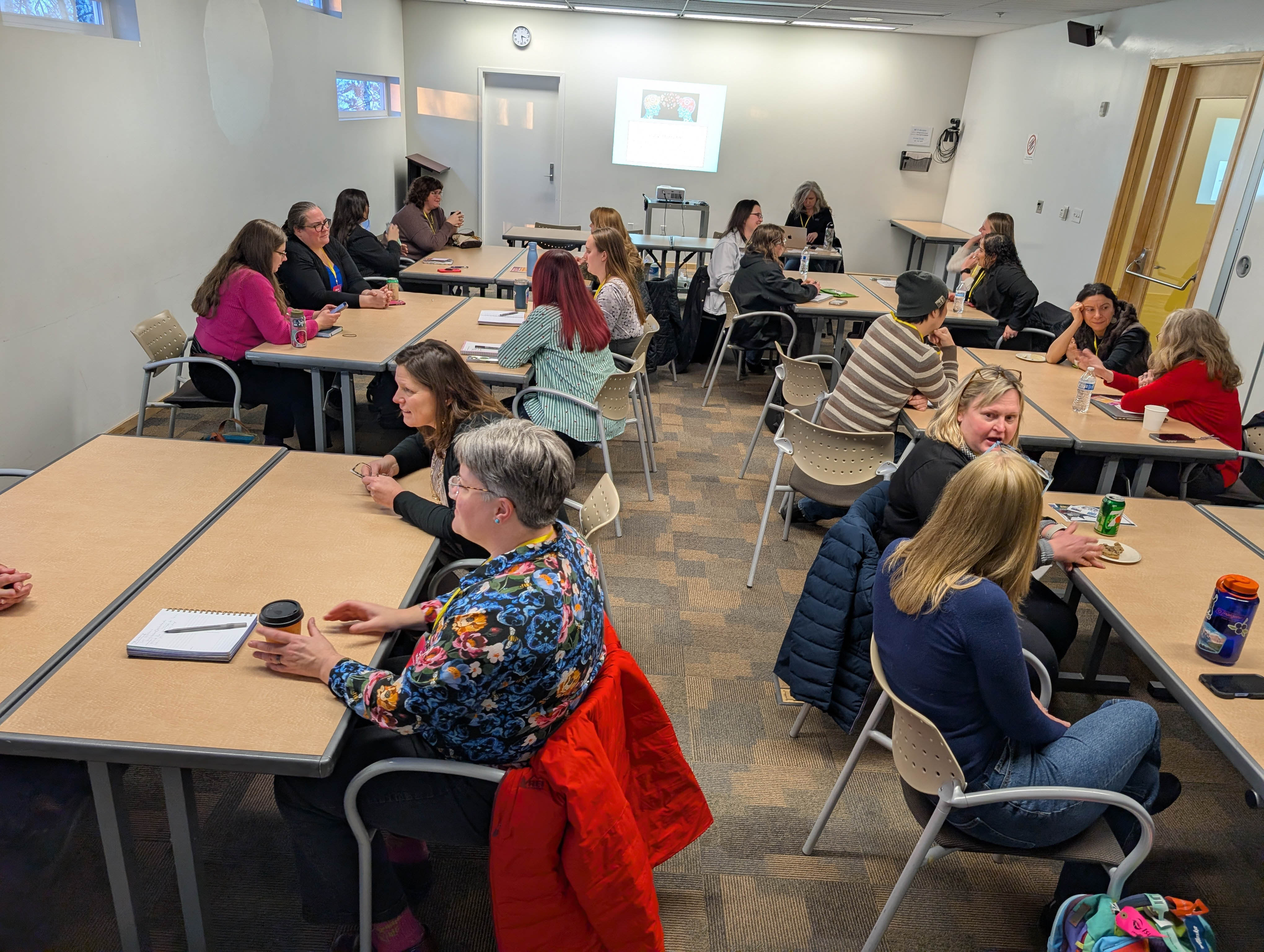 A classroom full of people having group discussion at IGNITE 2026.