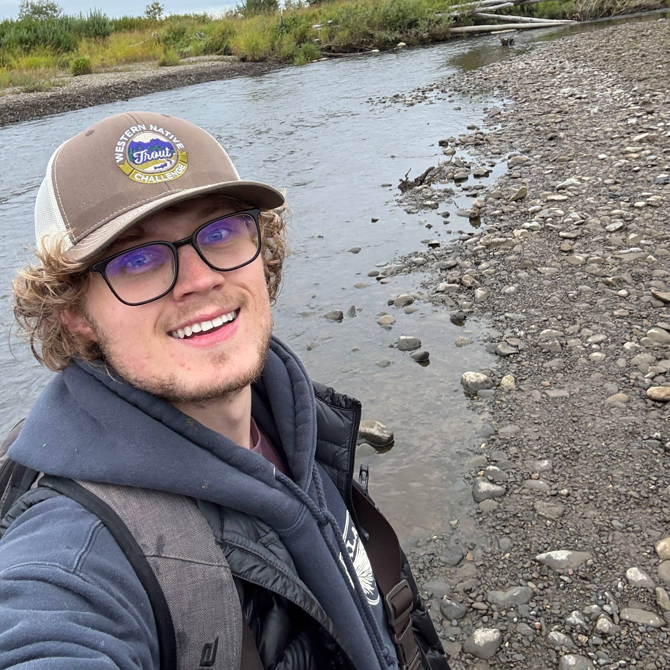 Tanner Van Orden stands on a streambed