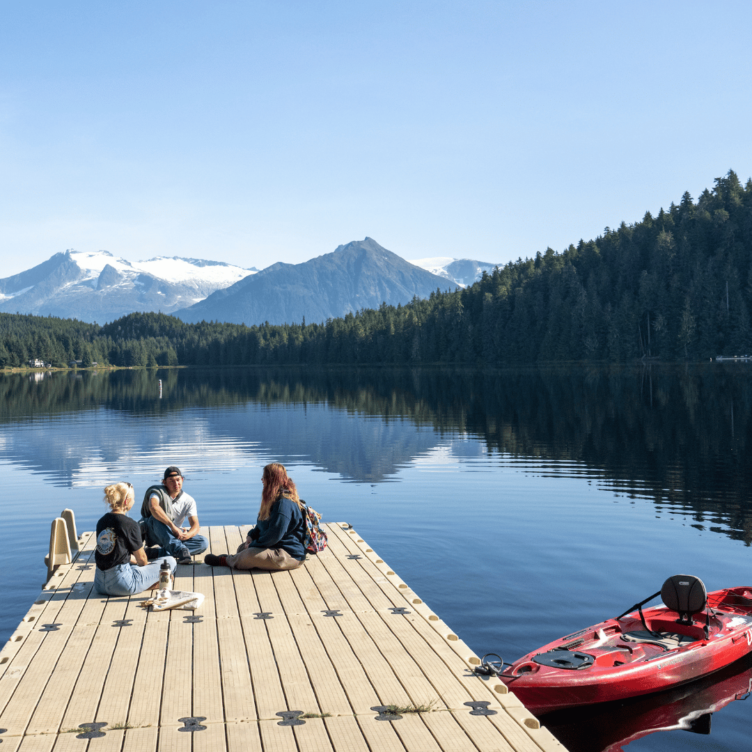 Students sitting on a dock at UAS