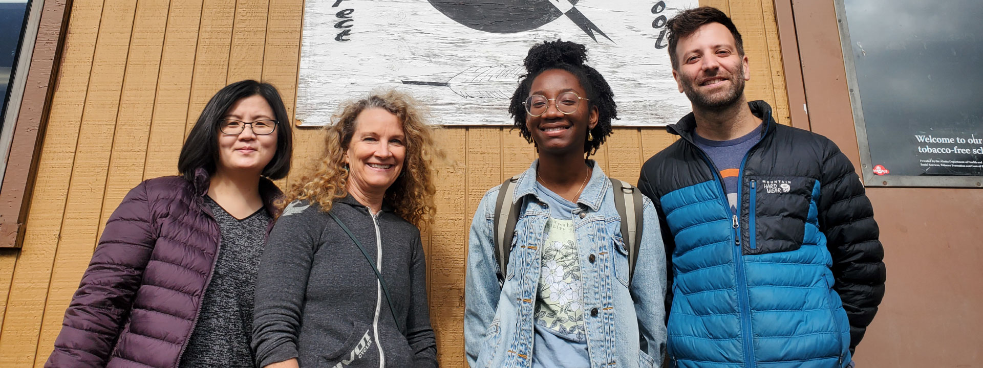 Teachers pose in front of Minto School