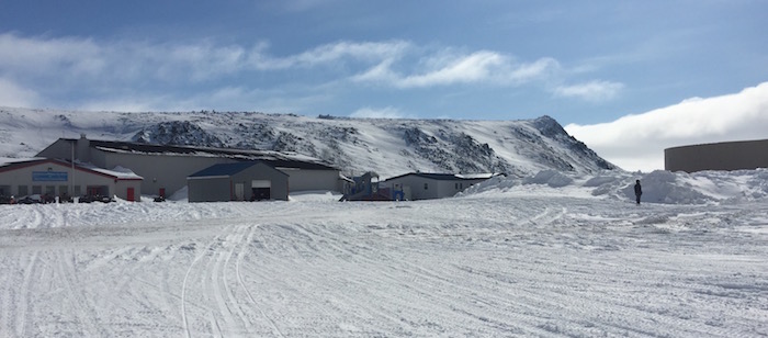 scientists digging out weather stations