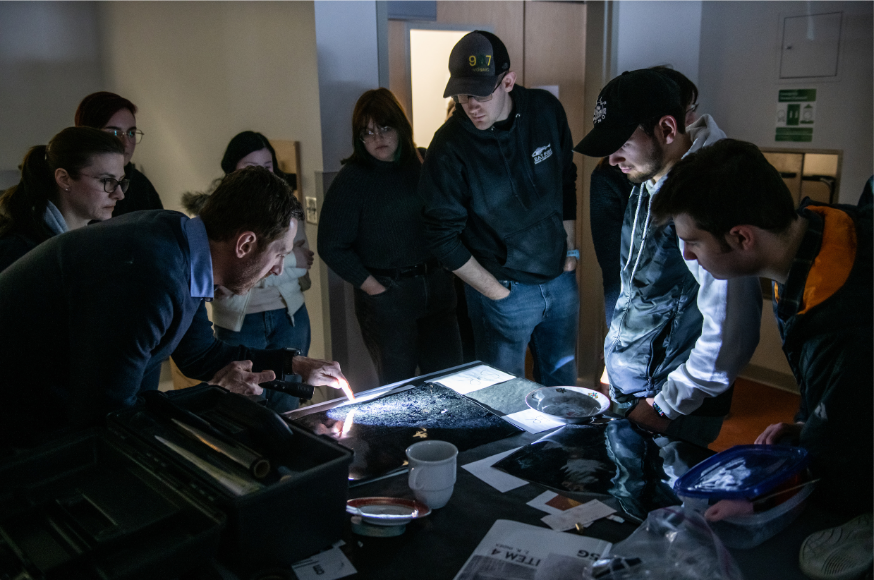 Lab Director David Kanaris shows students a projections screen