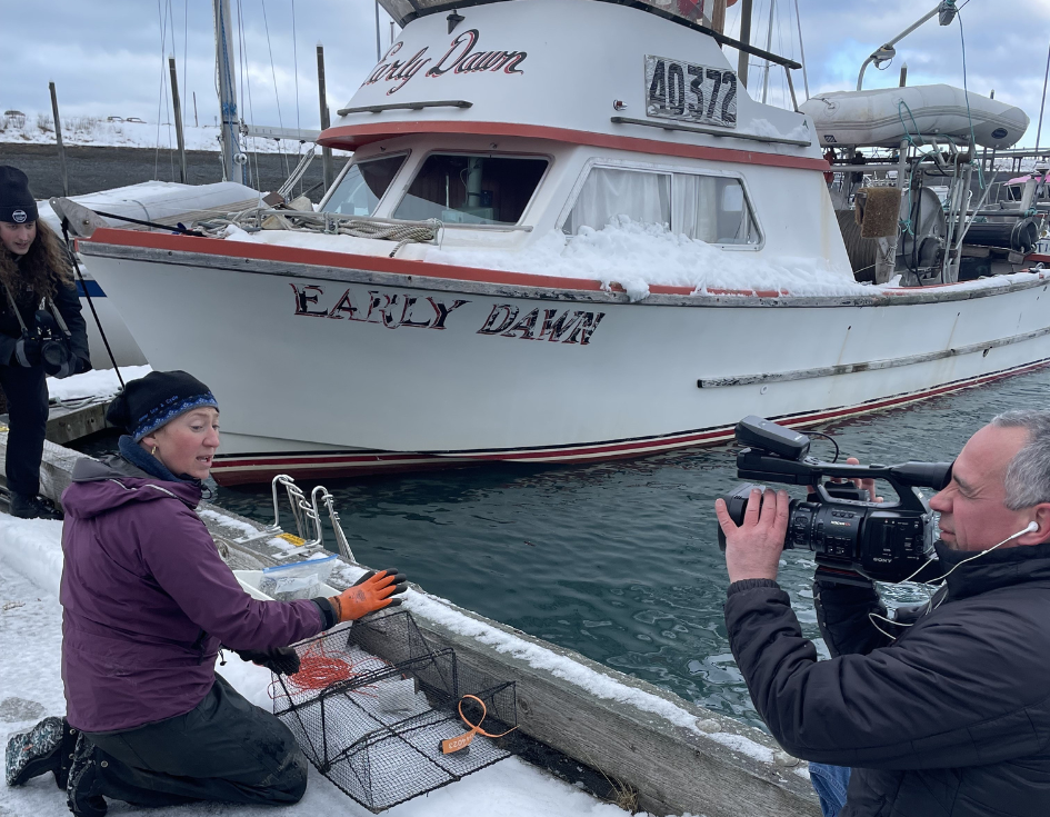 UAA students and team film Jasmine Maurer, the harmful species lead at KBNERR as she checks her crab traps in the Homer harbor