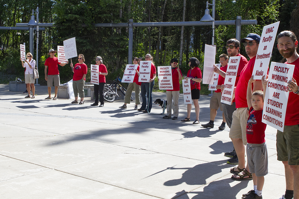 UNAC members stand outside BOR meeting