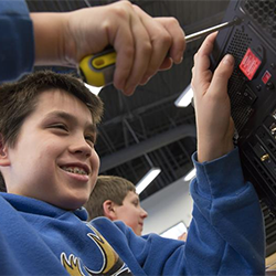 An ANSEP student uses a tool on a computer