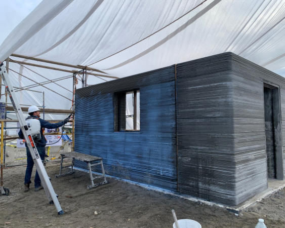 the 3D printer builds the walls of the test structure outside of Fairbanks