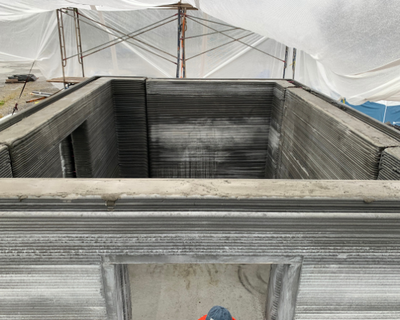 the 3D printer builds the walls of the test structure outside of Fairbanks