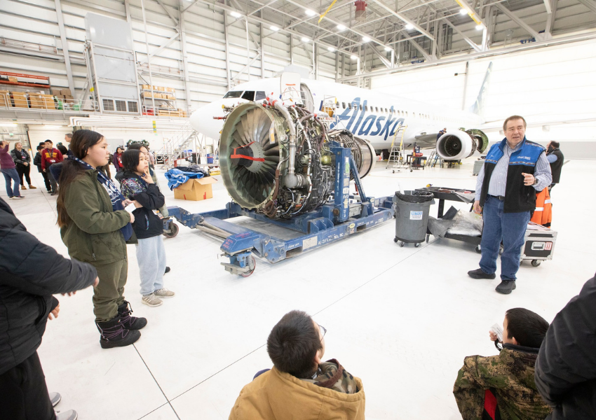 ANSEP students tour an Alaska Airlines maintenance hangar in Anchorage, getting an up-close look at a jet engine as part of the program's career exploration activities.