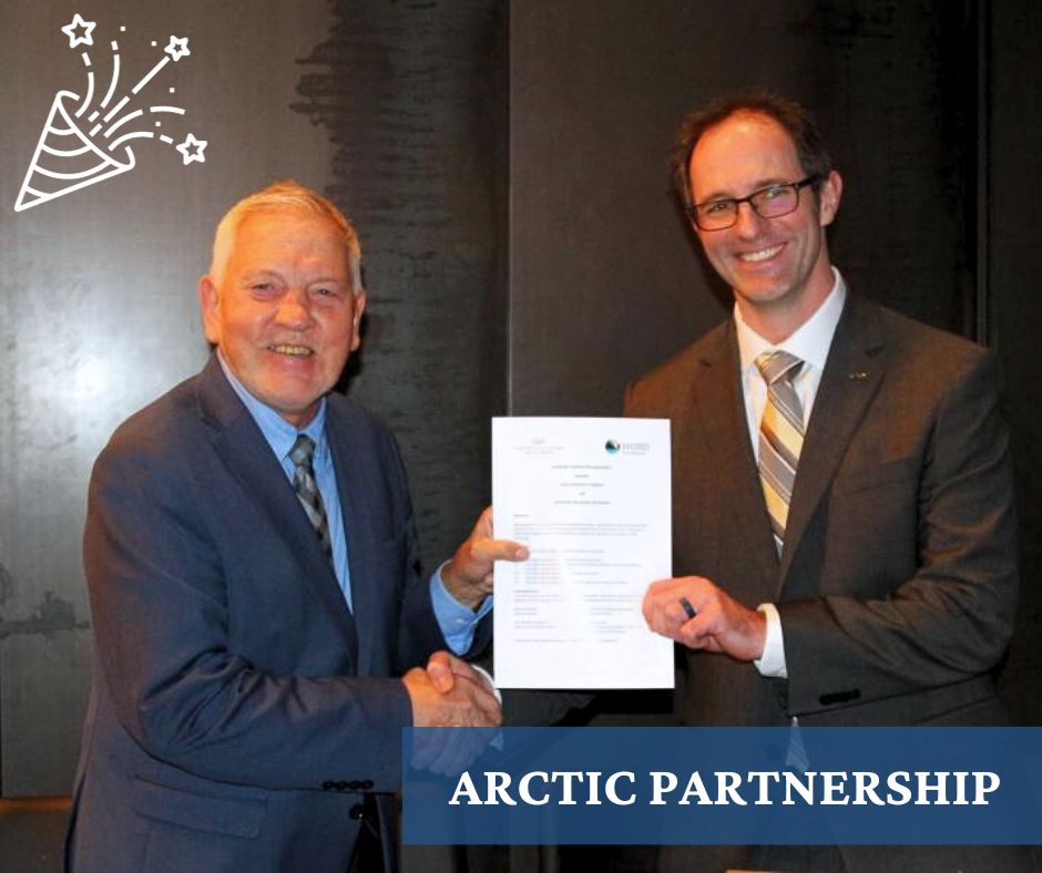 UAA's Vice Chancellor Aaron Dotson and Nord University's Frode Mellemvik shake hands