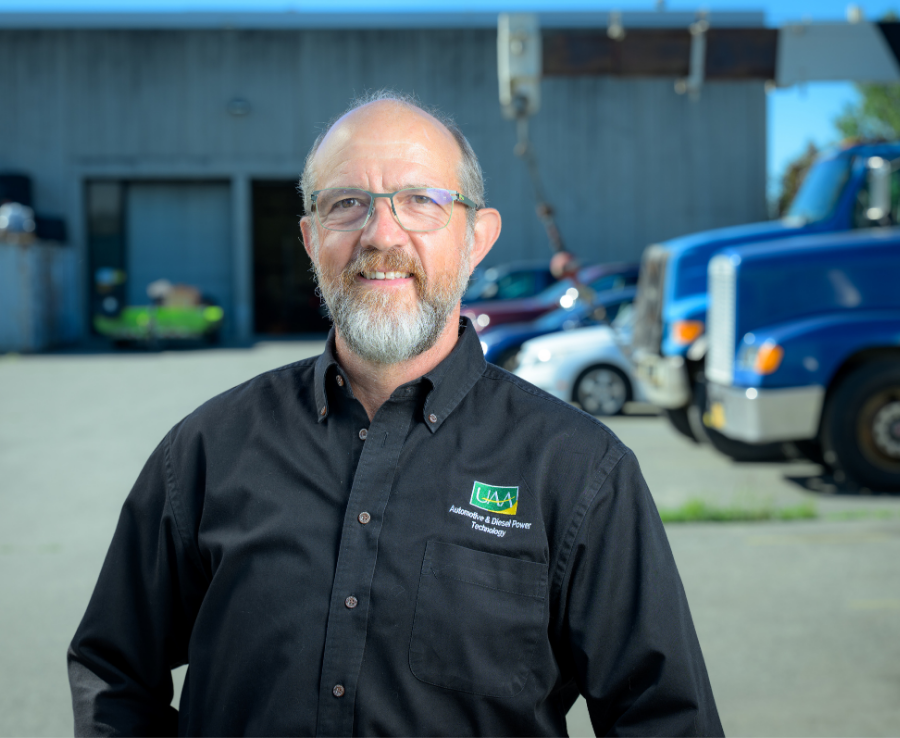 Darrin Marshall, chair of UAA's Automotive and Diesel Technology Department, stands outside the department building in Anchorage