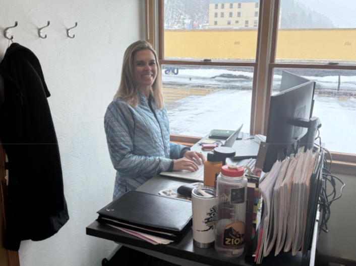 UA Foundation Director of Communication and Public Relations Maggie Demers works hard at the UA Office.