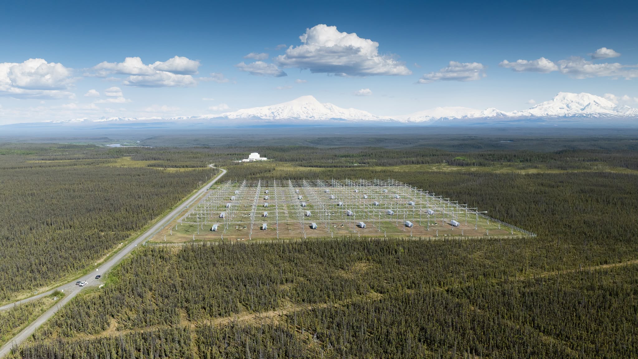 a big green field with white scientific instruments