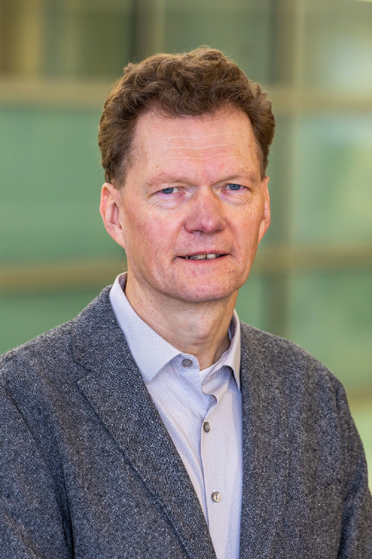 portrait of man in grey tweed sports coat