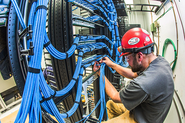 Technician works on cables