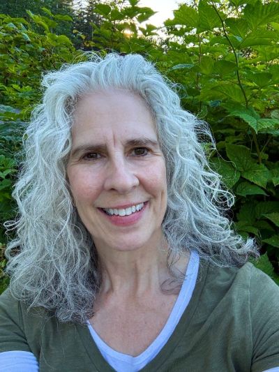 A woman with long grey hair