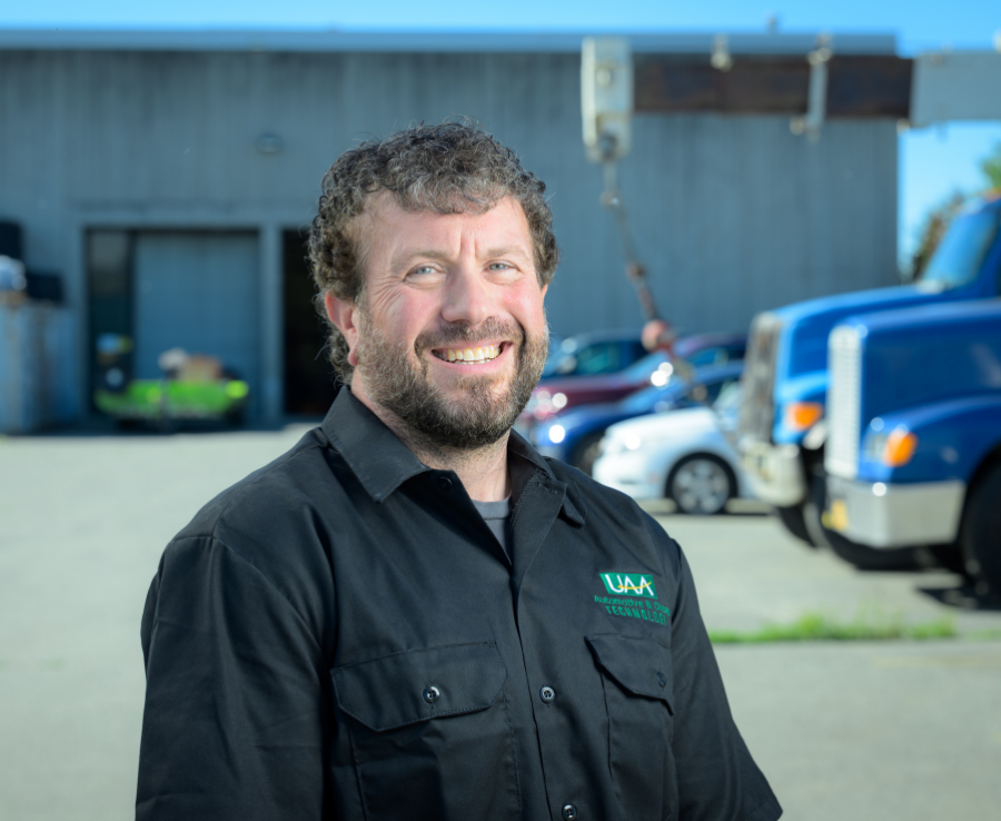 Rob Siciliano, GM ASEP instructor at UAA's Automotive and Diesel Technology Department, stands outside the department building in Anchorage.