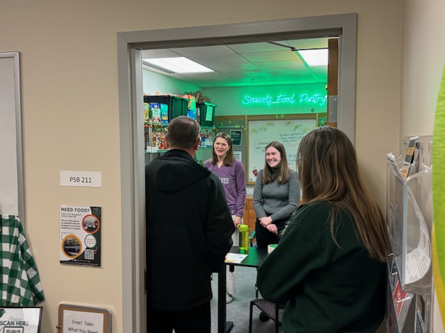 Visitors at the new pantry location look in