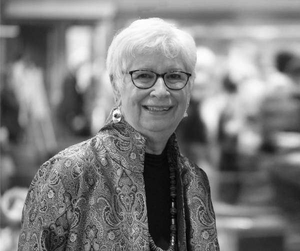 Black and white photograph of Douglas, with short white hair, black glasses 
