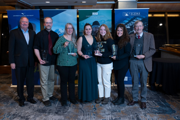 The group of six awardees stand with Tod Burnett