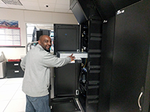 Ambrose Mazion demonstrates the ease of the ServerLIFT at the UA Data Center