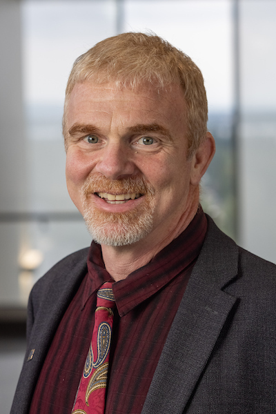 A man with short grey hair