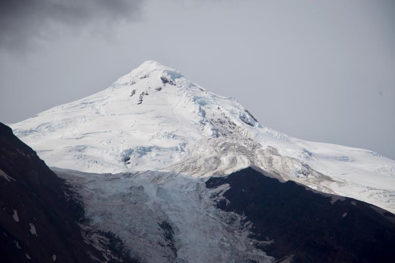 Black and white photo of Mount Spurr, white snow capped open top of mountain