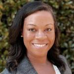 Rhonda Collins - a woman with long hair smiles at the camera