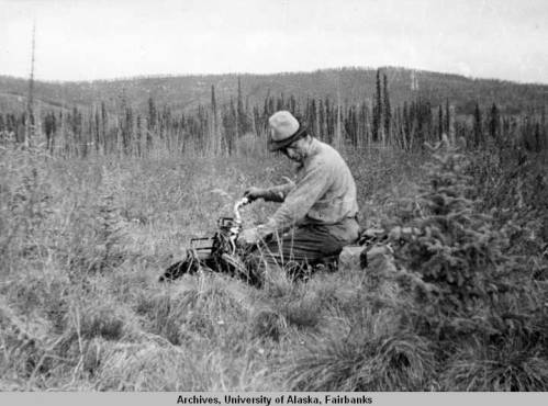 Slim riding a bucking two-wheeler through the muskeg