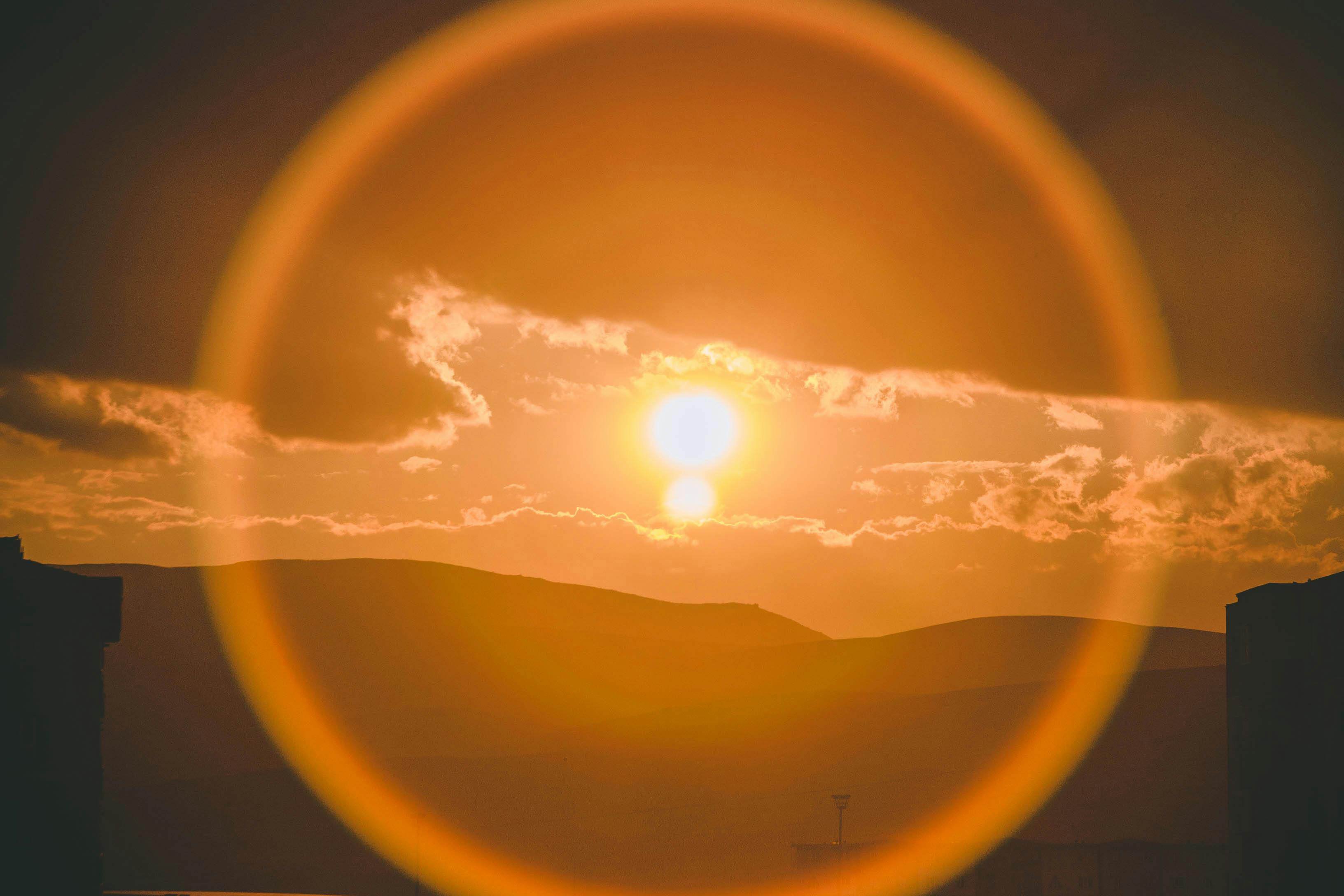 Restorative justice, peacemaking, and transformative justice Sun over mountains with lens flare
