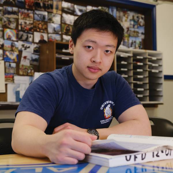 Man sitting reading a book