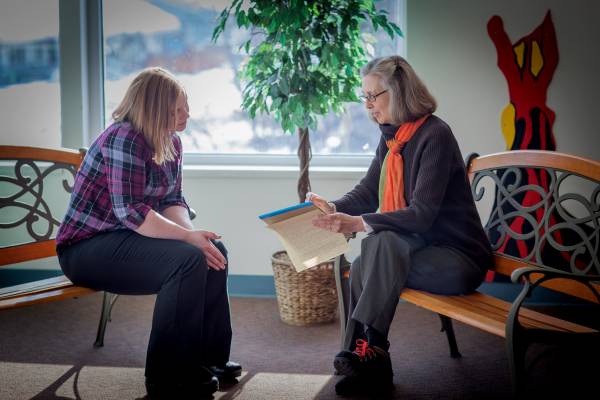 A teacher intern works with her mentor